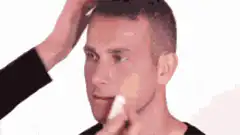 Man gets made up as a clown