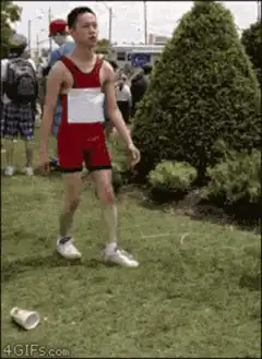 Man in red running outfit dramatically collapses