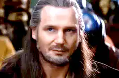 Liam Neeson smirking
