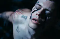 Evan Peters as Tate Langmont opening his eyes