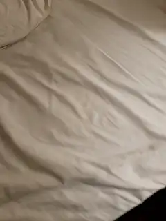 Hand opening a black butterfly knife