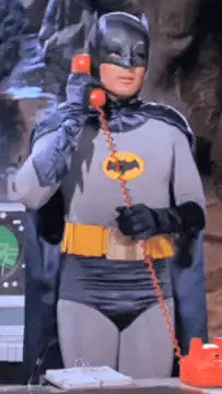 Batman talking on red phone