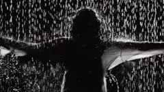 Woman dancing in the rain