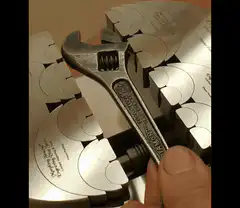 Wrench turning on a metal chuck