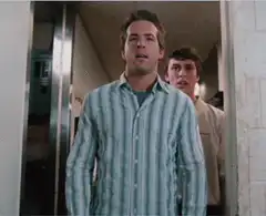 Ryan Reynolds and Jesse Eisenberg in a hallway