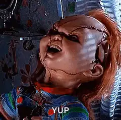 Chucky doll laughing with text YUP