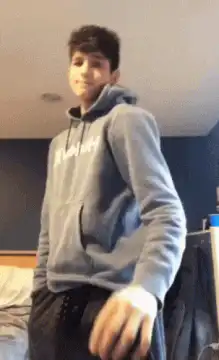 Guy takes off hoodie to reveal shirt