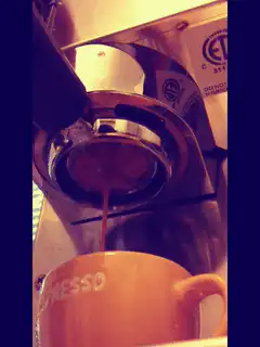 espresso pouring into cup