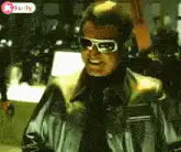 Rajinikanth laughing in sunglasses