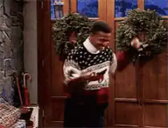 Martin Lawrence dancing in Christmas sweater