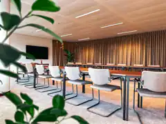 Modern conference room with long table and chairs