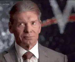Vince McMahon nodding and pointing