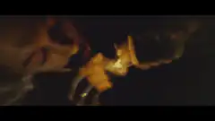 person lighting a cigarette in dim light