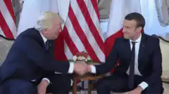 Donald Trump and Emmanuel Macron handshake