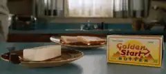 Man eats a block of butter