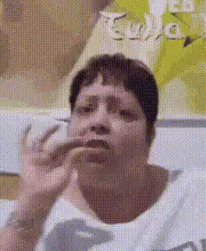 Woman making a pinching gesture