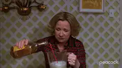Woman pouring drink into blender