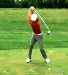 golfer swings club backwards