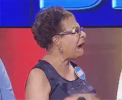 Elderly woman gasps and touches her throat