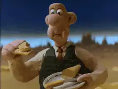 Wallace eating cheese