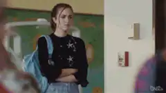 Girl presses fire alarm in school hallway