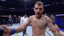 Dustin Poirier reaching out in MMA octagon
