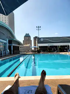 POV relaxing by a pool