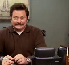 Ron Swanson holding a pen