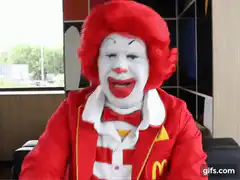 Ronald McDonald laughing and dancing