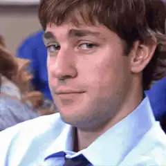 John Krasinski smirking and blinking