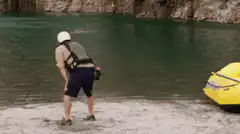 Man in helmet screams at water