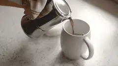 pouring coffee from moka pot