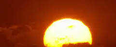 Sun exploding behind clouds