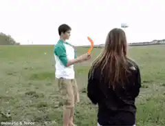 Boy throws boomerang hits girl in back