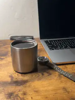 watch hand on desk