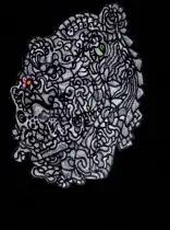 Colorful background fades behind black and white face