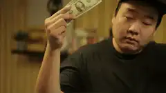 Man makes dollar bill disappear