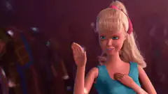 Barbie shrugs and smiles