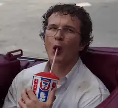 Alex Winter drinking a 7-Eleven Slurpee