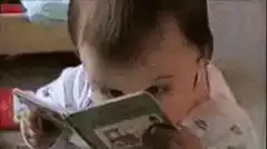 baby reading a book