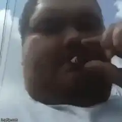 Man smoking a joint and exhaling smoke