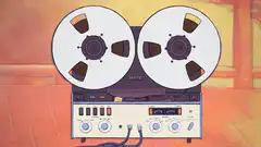 reel-to-reel tape recorder spinning