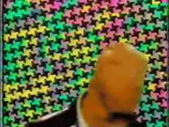 Agent Smith against colorful houndstooth