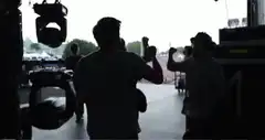 band members high five backstage