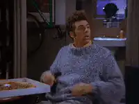 Joey crosses arms and looks smug