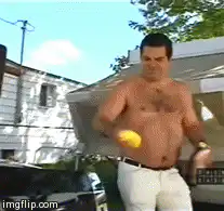 shirtless man juggling lemons