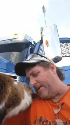 Man and cat selfie with truck