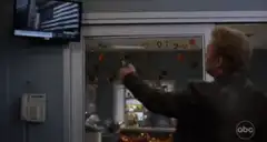 Man shooting letters off a window