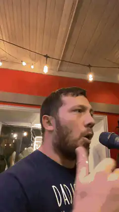 man singing into microphone