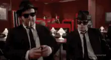 The Blues Brothers smoking and talking